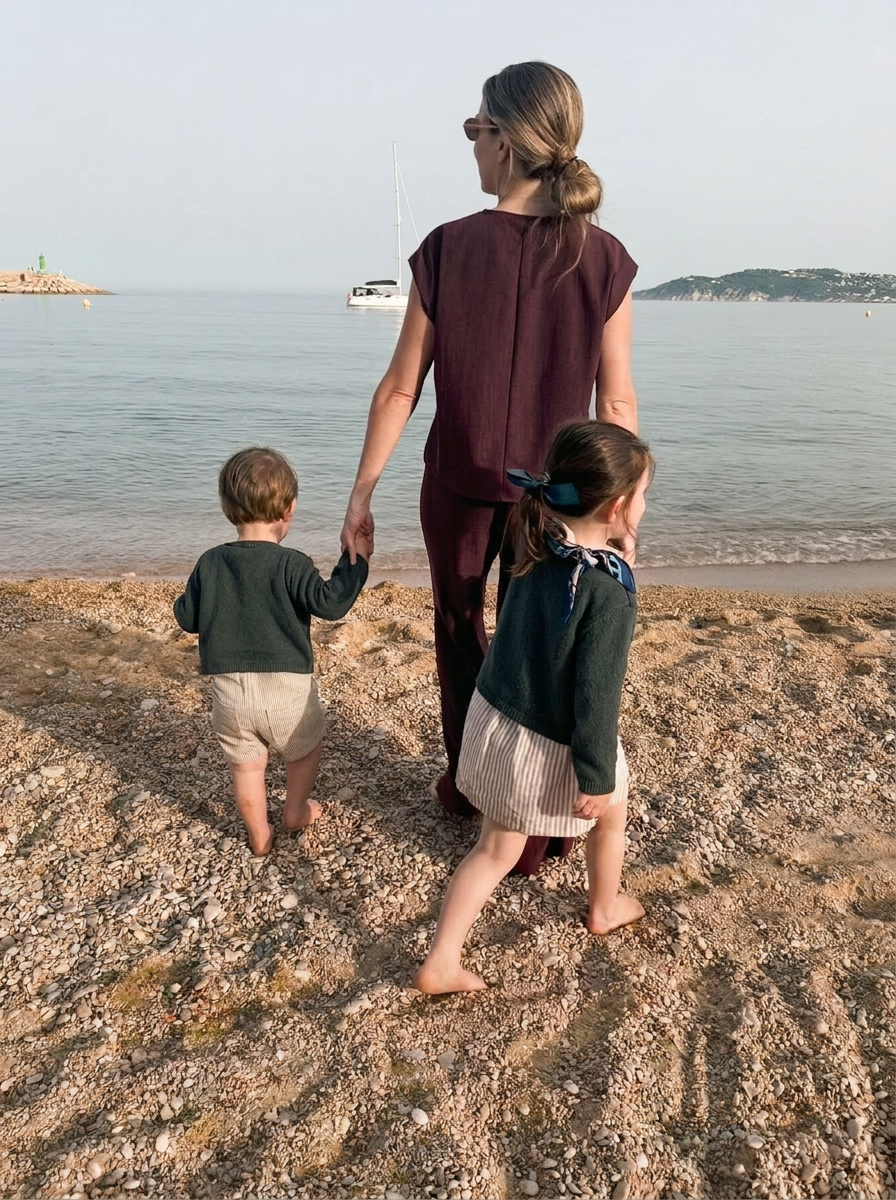 Clania walking with her two children along the Mediterranean shore